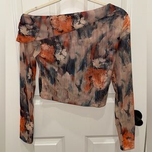 Commense‎ mesh off-the-shoulder top in a dreamy watercolor print.